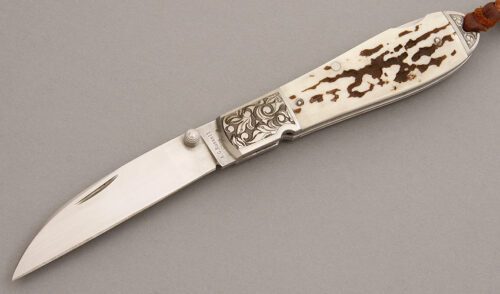 A.G. Russell Wharncliffe Teardrop Lockback with Jigged Antler handle material - Obverse Side - Item #KLC08101