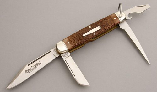 Remington Knives R4243 Camp Knife with Jigged Delrin handle material - Obverse Side - Item #KLC08117