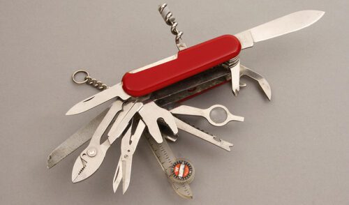 Wenger Delmont Knives Multi-Blade Swiss Army Knife with Red Delrin handle material - Obverse Side - Item #KLC08357