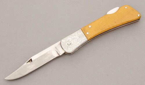 Lew Booth Lockback with Ivory Micarta handle material - Obverse Side - Item #KLC08599