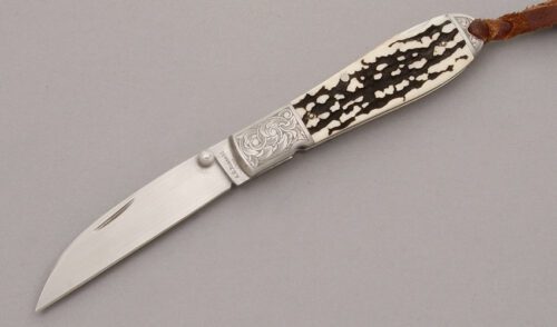 A.G. Russell Wharncliffe Teardrop Lockback with Jigged Antler Scales handle material - Obverse Side - Item #KLC08629