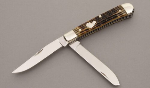 Ka-Bar Knives Union Cutlery Trapper with Roofline Licorice Jigged Bone handle material - Obverse Side - Item #KLC08653