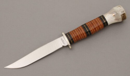 Northwoods Knives Button Hole with Stacked Leather handle material - Obverse Side - Item #KLC08781