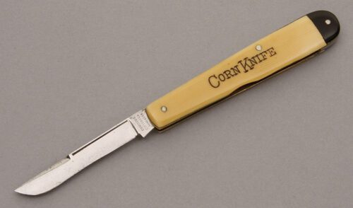 Camillus Cutlery Corn Knife with Ivory & Black Celluloid handle material - Obverse Side - Item #KLC08849