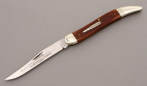 Winchester Knives .270 Cartridge Toothpick with Burnt Orange Jigged Bone handle material - Obverse Side - Item #KLC08921