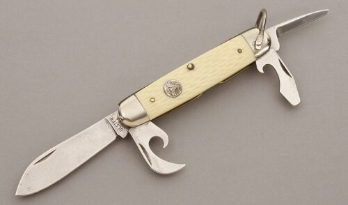Ulster Knives Boy Scout Knife with White Jigged Delrin handle material - Obverse Side - Item #KLC09347