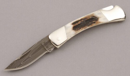 Buck Knives Knight Lockback with Nickel Silver Frame handle material - Obverse Side - Item #KLC09378