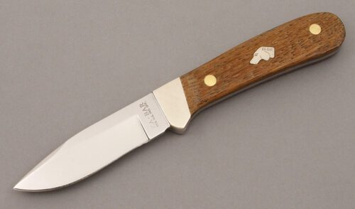 Ka-Bar Knives Dogs Head Trailing Pt. Hunter with American Chestnut Wood Scales handle material - Obverse Side - Item #KLC09410