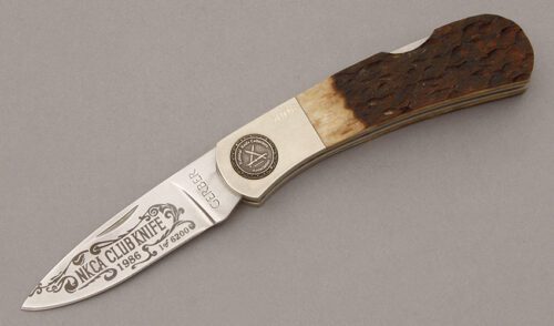 Gerber Knives 1986 NKCA Midlock Folder with Jigged Bone Handle Scales handle material - Obverse Side - Item #KLC09451