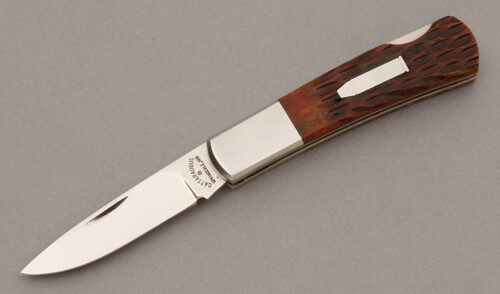 Cattaraugus Cutlery K.C.C. CM-11 Lockback with Brown Jigged Bone Scales handle material - Obverse Side - Item #KLC09475