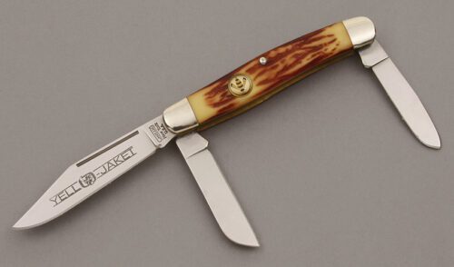 Camillus Cutlery Yello Jaket Stockman with Yellow & Brown Jigged Delrin handle material - Obverse Side - Item #KLC09483
