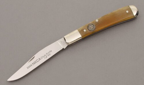 Canal Street Cutlery 2009 NKCA Half Moon Trapper with Smooth Rams Horn Handle Scales handle material - Obverse Side - Item #KLC09541