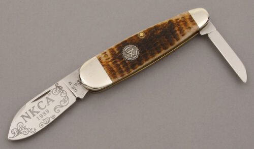 Case Cutlery 1989 NKCA Club Sleeveboard with Rogers Jigged Bone Scales handle material - Obverse Side - Item #KLC09549