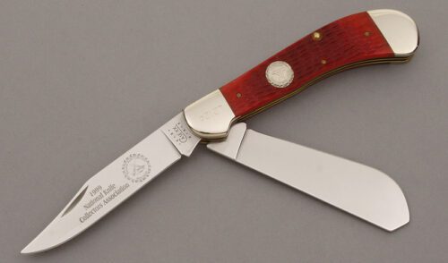 Case Cutlery 1999 NKCA Saddlehorn Trapper with Red Jigged Bone Scales handle material - Obverse Side - Item #KLC09553
