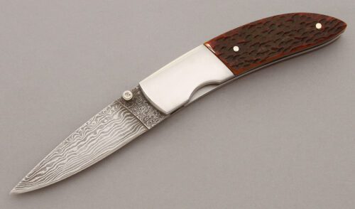 Jim Thompson Linerlock Folder with Amber Jigged Bone Handles handle material - Obverse Side - Item #KLC09734
