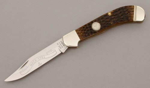 Case Cutlery 1991 NKCA Club Saddle Horn with Jigged Bone Scales handle material - Obverse Side - Item #KLC09790