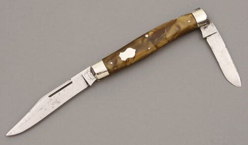 Remington Knives R3115 Moose with Brown Swirl Celluloid Scales handle material - Obverse Side - Item #KLC09873