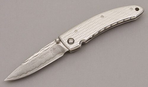 MCusta Knives Wave Damascus Framelock Folder with Wave Stainless Steel handle material - Obverse Side - Item #KLC10036