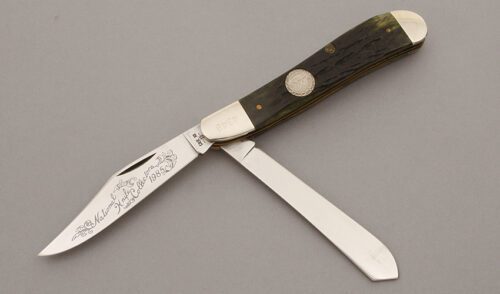 Case Cutlery 1985 NKCA Dogleg Trapper with Green Jigged Bone Scales handle material - Obverse Side - Item #KLC10364