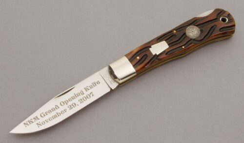 Schatt & Morgan 2007 NKM Mountain Man Lockback with Worm Groove Jigged Bone Scales handle material - Obverse Side - Item #KLC10478