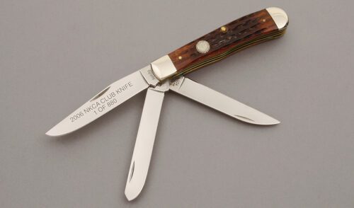 Kinfolks Knives 2006 NKCA Three Blade Trapper with Walnut Jigged Bone Scales handle material - Obverse Side - Item #KLC10479