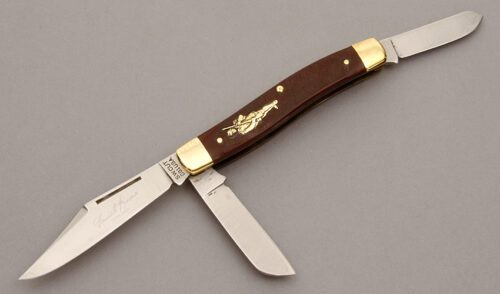 Schrade Walden DB1 Daniel Boone Stockman with Maroon Sawcut Delrin Scales handle material - Obverse Side - Item #KLC10541