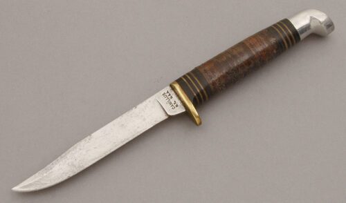 Camillus Cutlery Small Clip Point Hunter with Stacked Leather Handle handle material - Obverse Side - Item #KLC10573