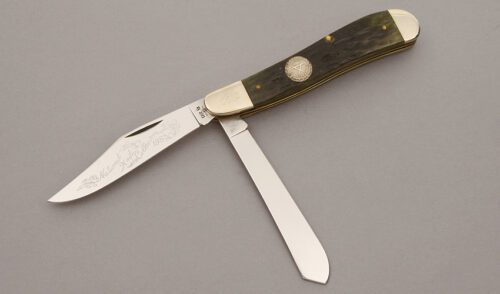 Case Cutlery 1985 NKCA Dogleg Trapper with Green Jigged Bone Scales handle material - Obverse Side - Item #KLC10618