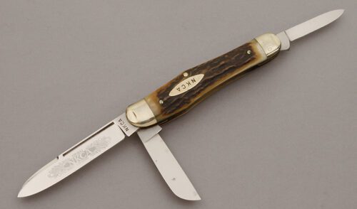 Kissing Crane 1980 NKCA Gunstock with Stag Handle Scales handle material - Obverse Side - Item #KLC10619