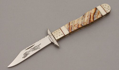 Case Cutlery Cheetah Swing Guard Folder with Mammoth Tooth Handle Scales handle material - Obverse Side - Item #KLC10681