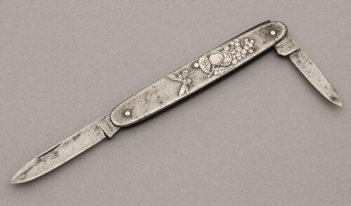 George Worthington Co. Two Blade Pen Knife with Embossed Steel Frame handle material - Obverse Side - Item #KLC10747