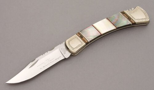Buck Knives 110 M. Prater/D. Yellowhorse with N/A handle material - Obverse Side - Item #KLC10880