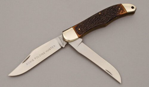 Schrade Cutlery Bowie Folding Hunter with Jigged Delrin Handle Scales handle material - Obverse Side - Item #KLC10908