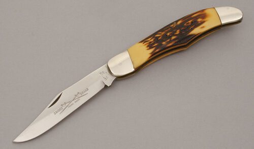 Camillus Cutlery Folding Hunter with Jigged Delrin Handle Scales handle material - Obverse Side - Item #KLC10909