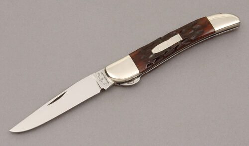 Cattaraugus Cutlery CM-12 Split Bolster Jack with Brown Jigged Bone Scales handle material - Obverse Side - Item #KLC11255