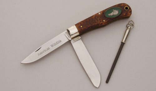 Camillus Cutlery Wildlife Series Trapper Bear with Jigged Delrin Scales handle material - Obverse Side - Item #KLC11396