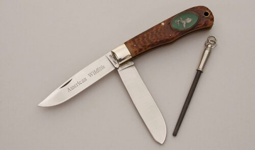 Camillus Cutlery Wildlife Series Trapper Deer with Jigged Delrin Handle Scales handle material - Obverse Side - Item #KLC11397