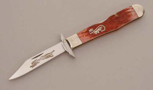 Case Cutlery Cheetah Swing Guard Lockback with Cranberry Jigged Bone Scales handle material - Obverse Side - Item #KLC11621