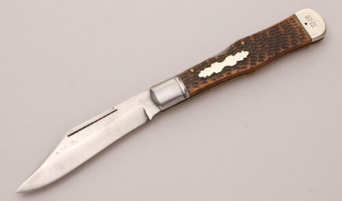 Marshall Wells Hwd. Co Folding Lockback Hunter with Brown Peachseed Jigged Bone handle material - Obverse Side - Item #KLC12189