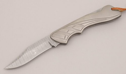 Boker Knives 1994 Damast Limited Edtiton with Embossed Titanium Frame handle material - Obverse Side - Item #KLC12373