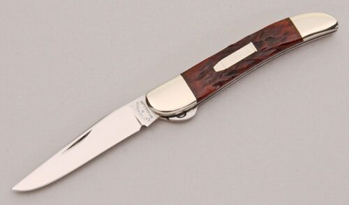 Cattaraugus Cutlery CM-12 Split Bolster Jack with Brown Jigged Bone Scales handle material - Obverse Side - Item #KLC12447