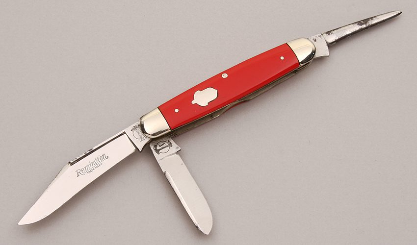 Remington Knives R3415 Stock Knife with Red Pyremite Handles handle material - Obverse Side - Item #KLC12460