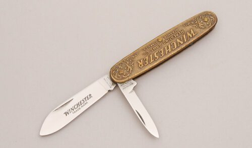 Winchester Knives 1987-1 Slip Joint Folder with Embossed Bronze Frame handle material - Obverse Side - Item #KLC12743