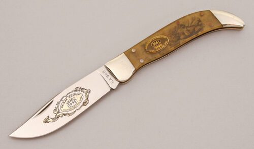 Ka-Bar Knives 1990 Collectors Club Grizzly with Acrilic Handle Scales handle material - Obverse Side - Item #KLC12893