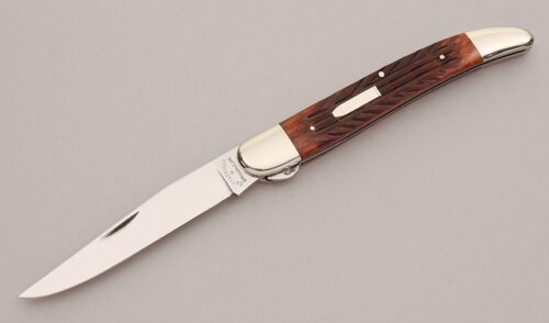 Cattaraugus Cutlery FH-1 Split Bolster Hunter with Brown Jigged Bone Scales handle material - Obverse Side - Item #KLC13117