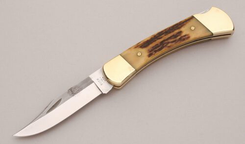 Buck Knives 110 Lockback Folder with Stag Handle Scales handle material - Obverse Side - Item #KLC13149