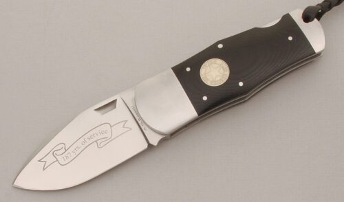 A.G. Russell 2010 Texas Ranger Lockback with Ebony Rucarta Handle Scales handle material - Obverse Side - Item #KLC13500