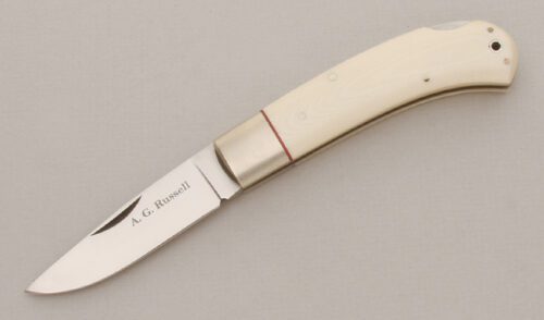 A.G. Russell Lockback Folder with White Linen Micarta Scales handle material - Obverse Side - Item #KLC13503