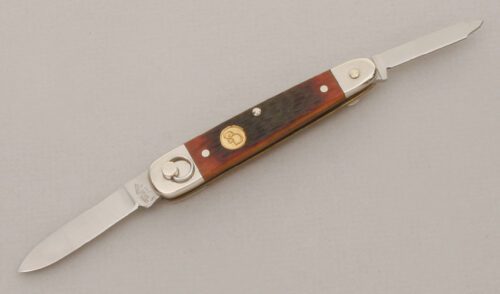 Canal Street Cutlery Sleeveboard Ring Opener with Amber Jigged Bone Scales handle material - Obverse Side - Item #KLC13504