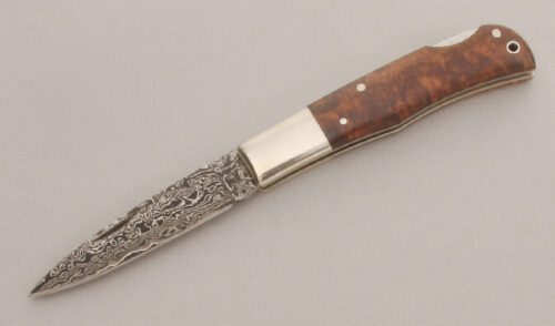 A.G. Russell 340 Damascus Lockback with Chinese Quince Burl Wood handle material - Obverse Side - Item #KLC13532